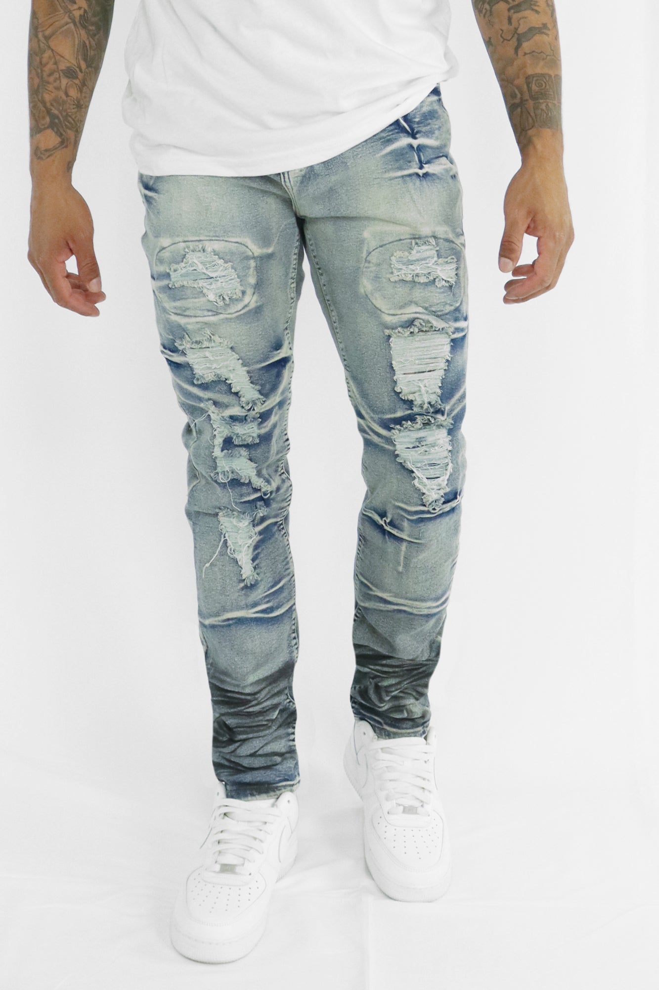 LIGHT BLUE JEANS - RIPPED AND REPAIRED