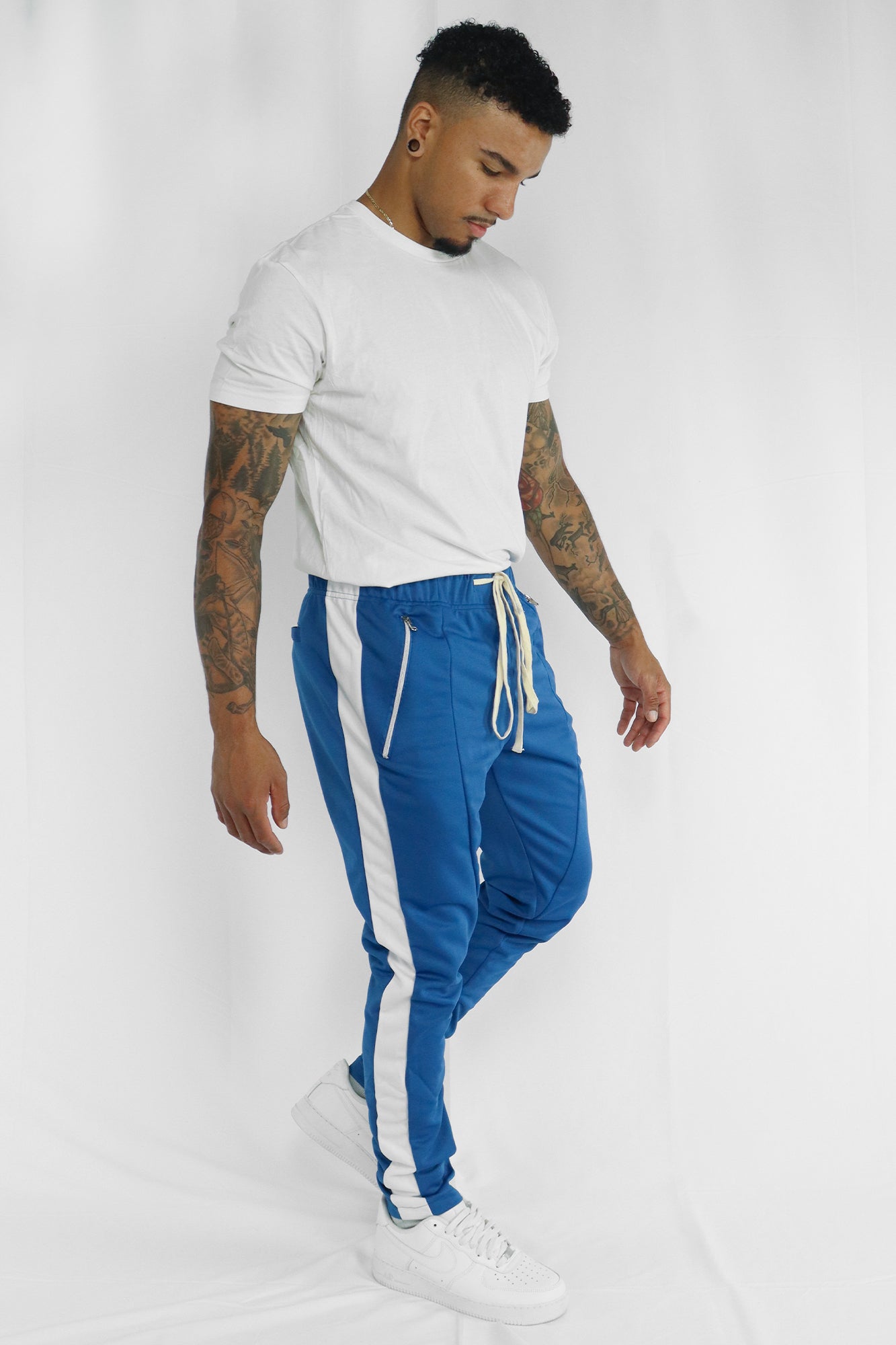 White and blue store track pants